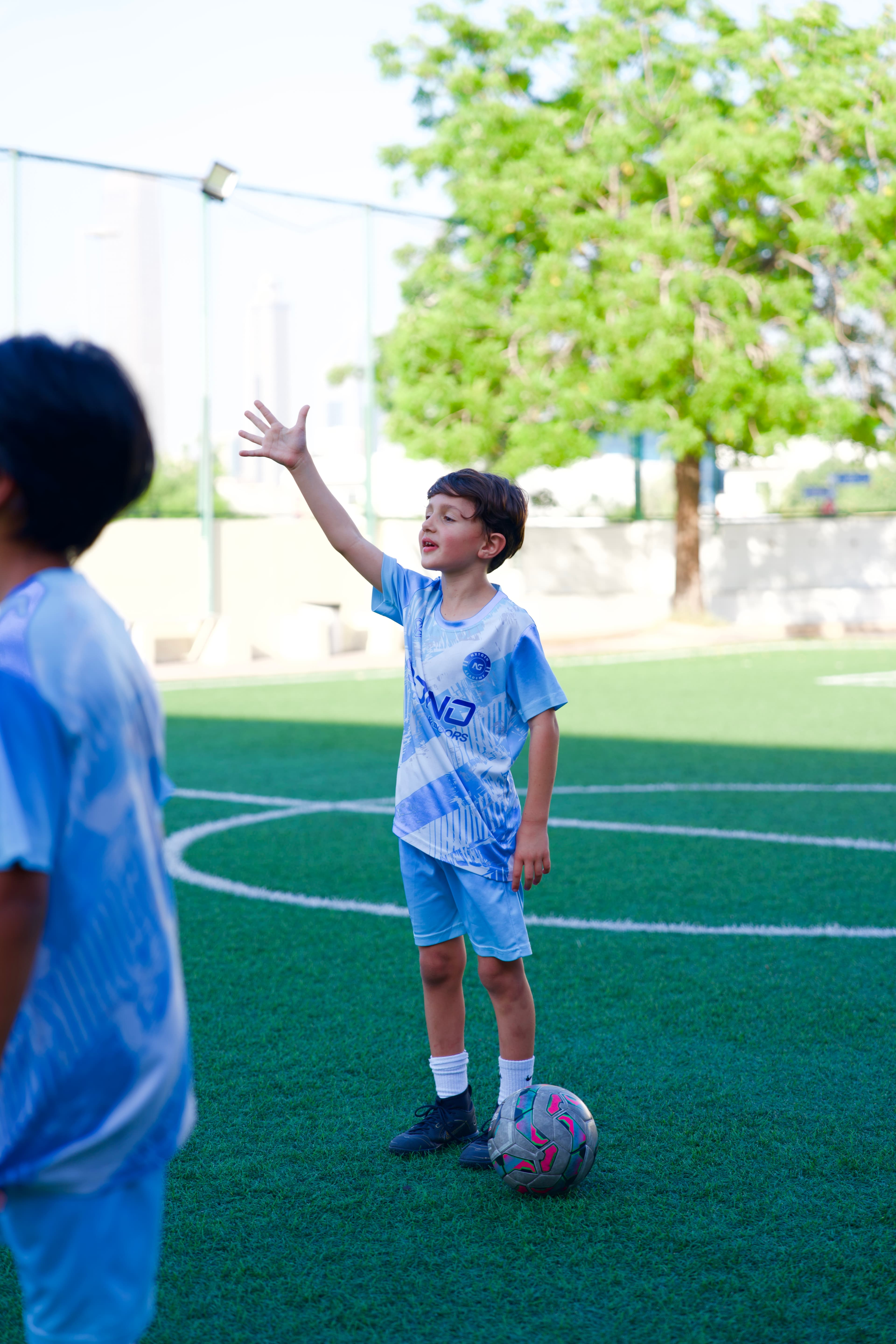 A NXTGEN Pre-Squad player communicates during a training session.